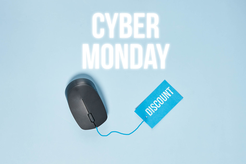 a photo of the best cyber monday deals online depicting a mouse with a discount tag.